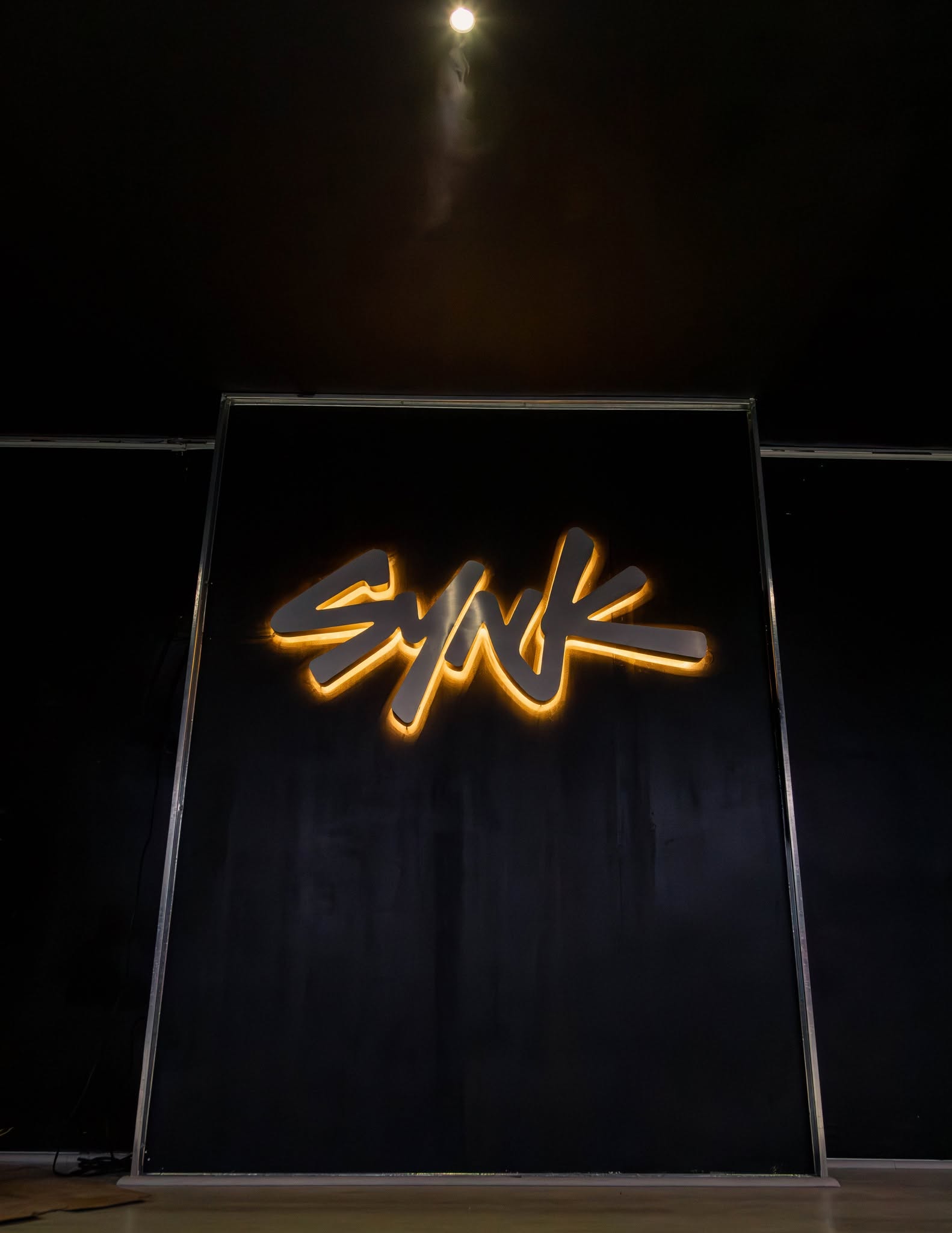 SYNK Dance Studio — the illuminated SYNK sign